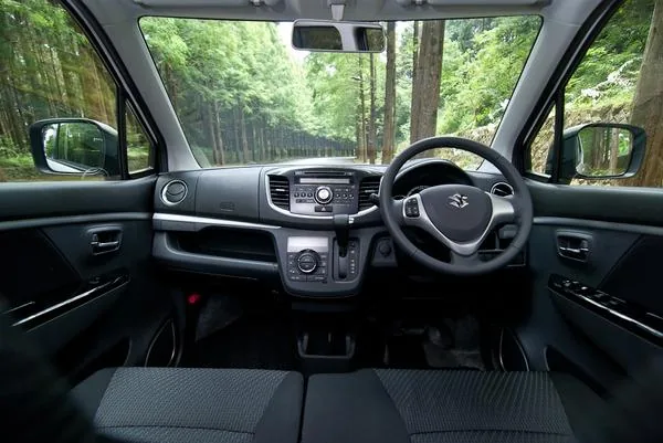 Suzuki Wagon R interior with steering wheel, dashboard and air conditioning controls