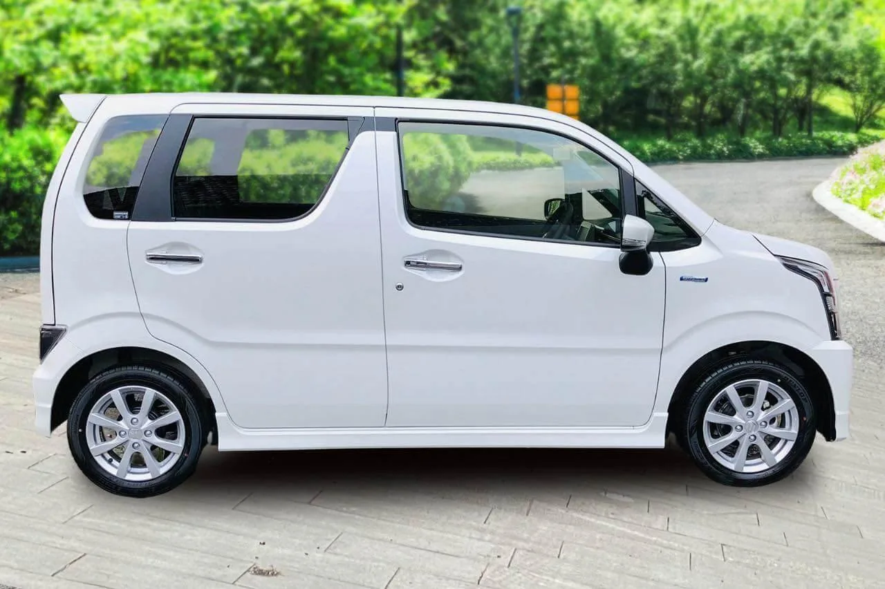 Side view of a white Suzuki Wagon R for cheap self-drive rental in Sri Lanka